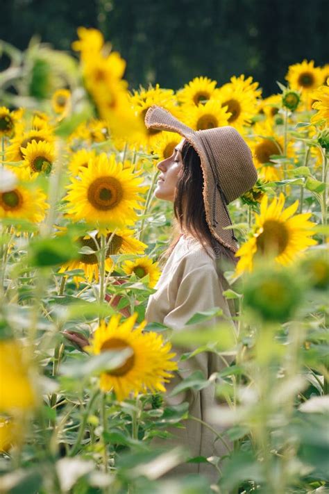 Young Girl In A Hat On A Field Of Sunflowers Stock Photo Image Of