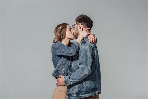 Seductive Young Couple In Denim Jackets And Eyeglasses Kissing Stock