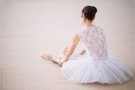 ballet dancer resting on the floor by stocksy contributor michela ravasio stocksy