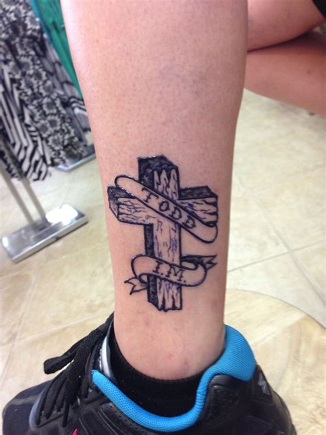Henna tattoos covering the hands to the elbow and the feet to the knee: Cross on the ankle henna tattoo | Ankle henna tattoo ...