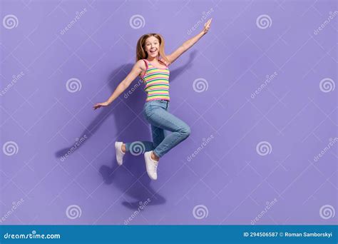 Full Size Photo Of Pretty Teenager Blonde Girl Jump Hands Fly Wings Plane Wear Trendy Striped