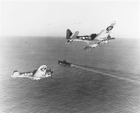 Two Sbd 5 Bombers Turn Into The Landing Pattern As They Return To Uss
