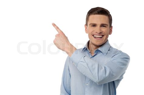 Smiling Man Pointing His Finger On Stock Image Colourbox