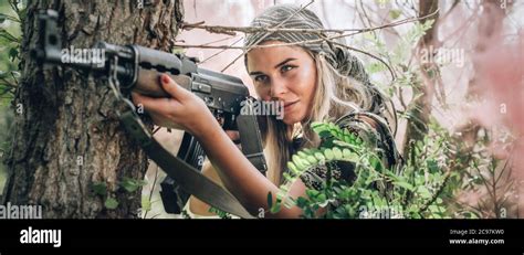 Beautiful And Attractive Woman Soldier Shooting With Rifle Machine Gun