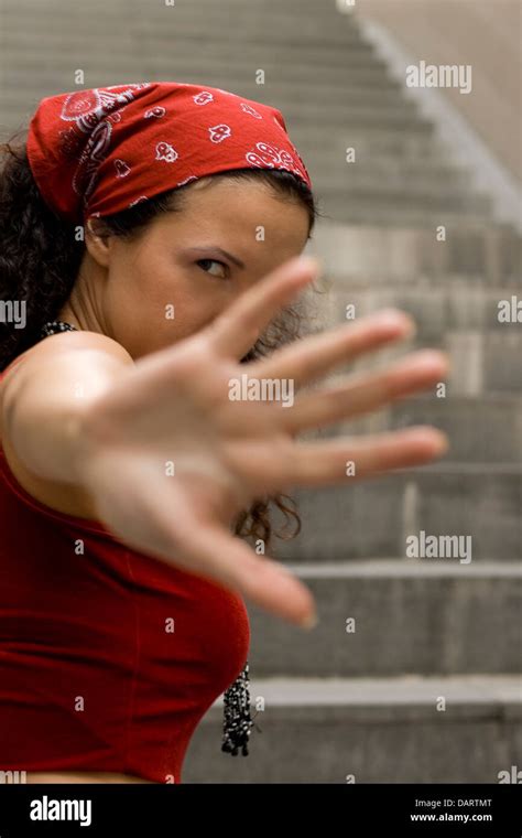 Woman In Red Hides Her Face Stock Photo Alamy