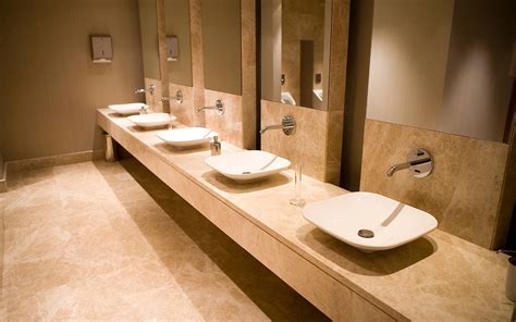 If you have a long and narrow bathroom, you can literally line stalls down the entire length of one wall, then line sinks and mirrors down the entire length of the other wall. Bathroom Interior Design, Commercial Bathroom Design