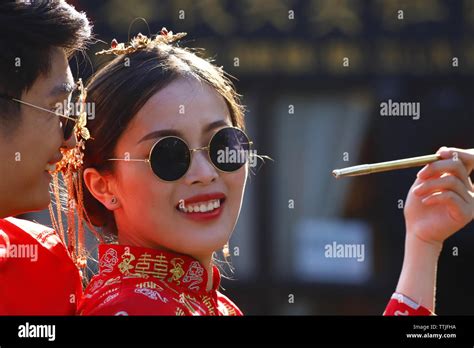 bride with a traditional dress shu he is the village where the bride and groom come to be