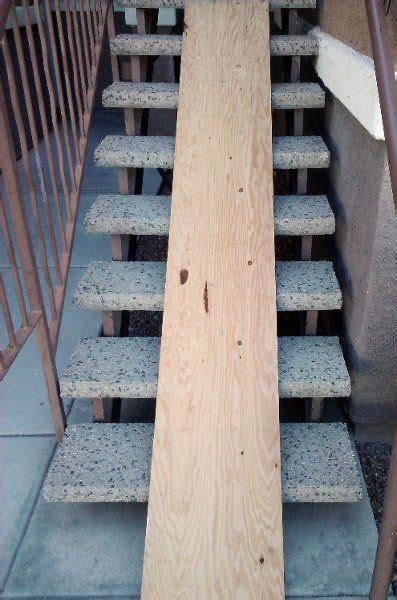 The dark stained oak treads are paired with a painted riser and stringer. Moving? Don't carry those boxes, make a ramp! | Stair slide, Moving tips, New homes