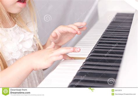 Child Playing On Piano Stock Photo Image Of Face Children 32612870