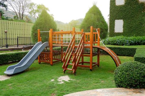Wooden Slides Children`s Toys In The Green Lawn Stock Photo Image Of