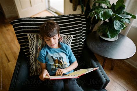 Overhead View Of Boy Reading By Stocksy Contributor Maria Manco