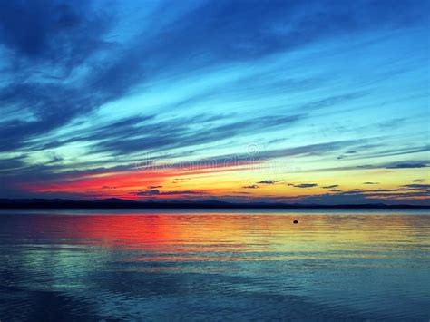 Colorful Blue And Orange Sunset Sky Over The Lake Blue Hour Stock