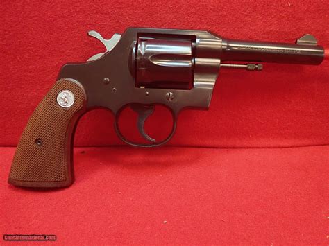 Colt Official Police 38 Special 4 Barrel Revolver Blued Wood Grips