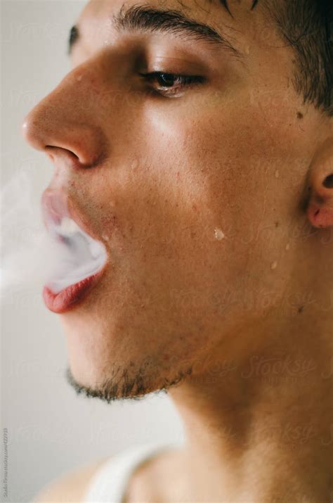 Babe Man Smoking A Cigarette By Stocksy Contributor Studio Firma Stocksy