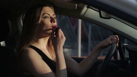 Beautifu Woman Applying Makeup In The Car Stock Video Footage Storyblocks