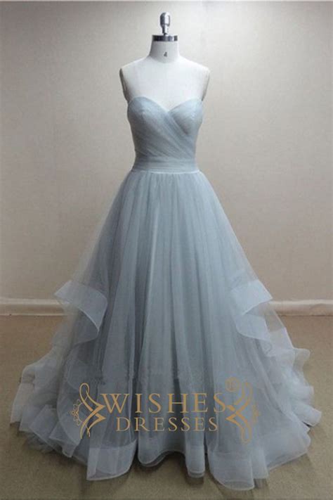 Cutting and sewing of original removable light skirt. Organza fabric bridal gown with sweetheart neckline and ...