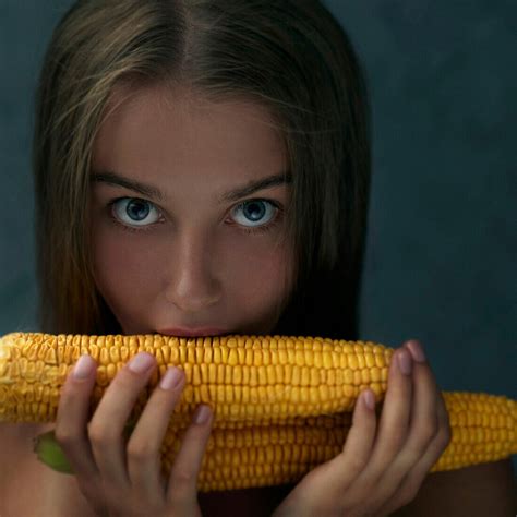 caucasian girl eating corn on cob license image 71154741 lookphotos
