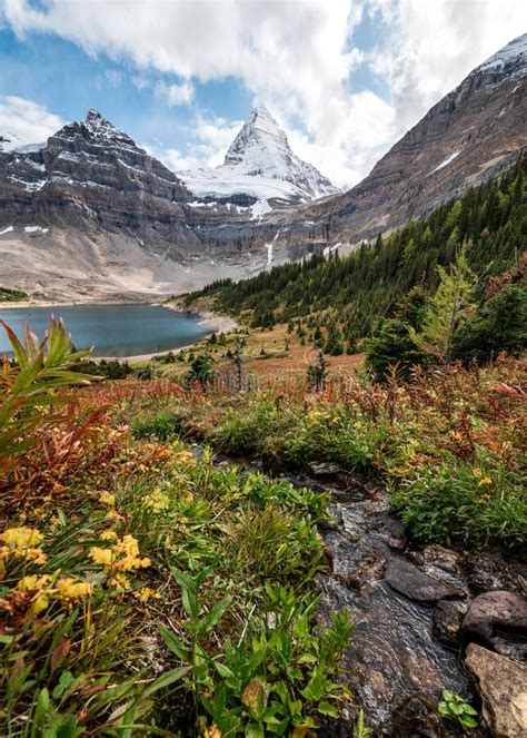Mount Assiniboine With Lake Magog In Autumn Wilderness At Provincial
