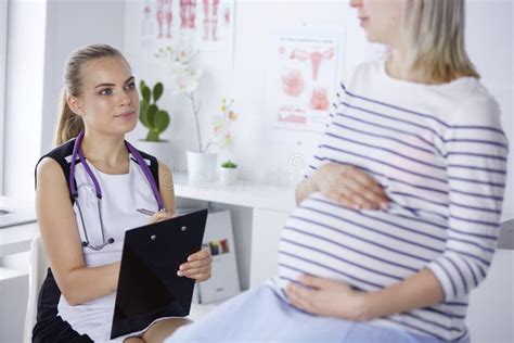 Gynecology Consultation Pregnant Woman With Her Doctor In Clinic Stock