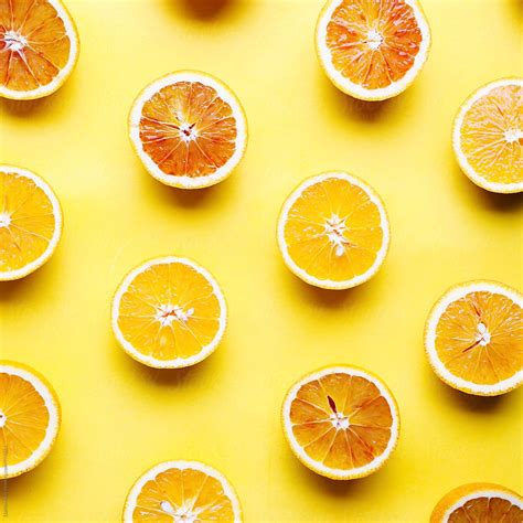 Oranges On A Yellow Background By Stocksy Contributor Darren Muir