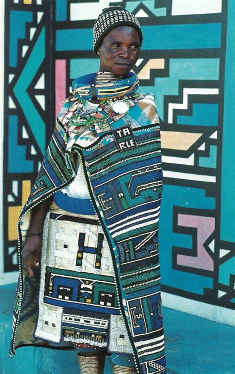 A woman s guide to business formal wear sumissura. So beautiful | Ndebele woman standing in front of a traditionally painted Ndebele home. South ...