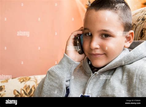 Latin Boy Talking On Cell Phone Stock Photo Alamy