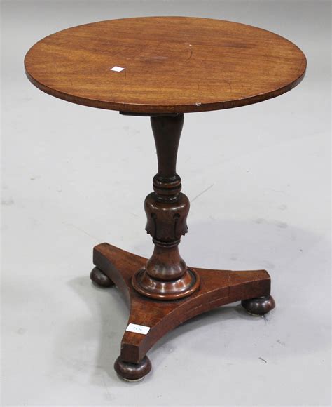 A Victorian Mahogany Circular Wine Table On A Turned Baluster Column