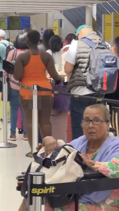 Seemingly Half Naked Woman Strolls Through Florida Airport This Aint