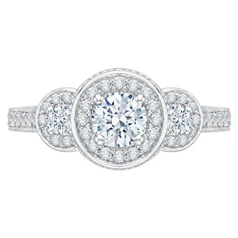 Raleigh's largest fine jewelry showroom This piece by Promezza, is a threes stone halo arrangement engagement ring with a .5 carat Round ...