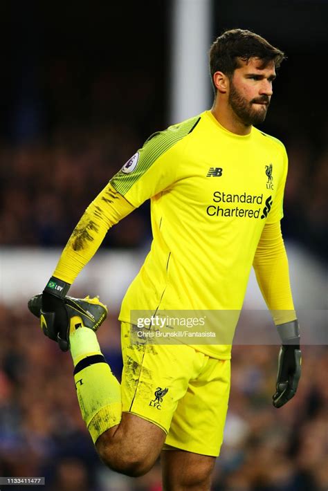 Alisson Of Liverpool Looks On During The Premier League Match Between