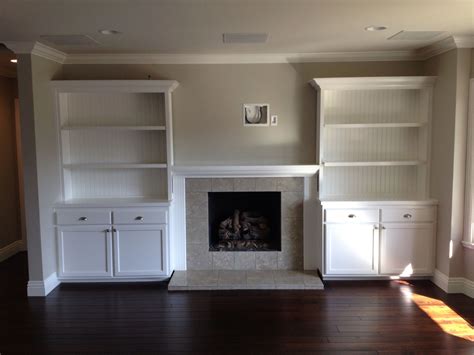 The fireplace features adjustable flame brightness, flames with or without heat, and color changing flames. Built in cabinets around fireplace | Custom Cabinetry ...