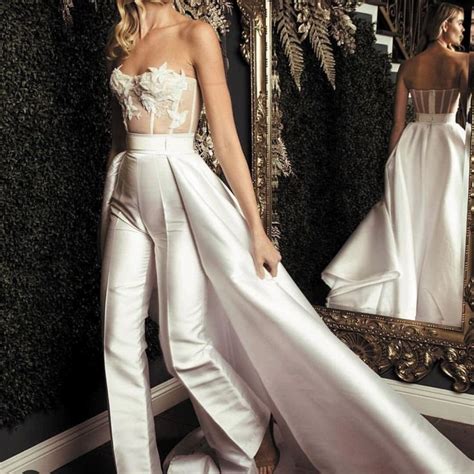 Bustle can also function as a noun, and refer to the style once it's sewn. white jumpsuits for women 2020 lace appliqué elegant ...