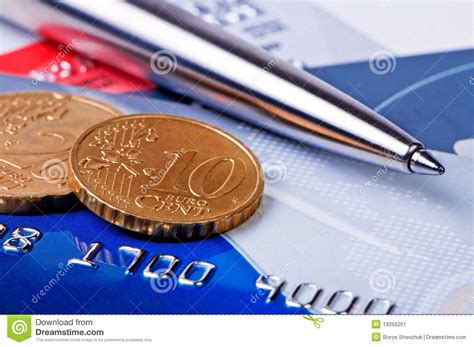 Earn up to 15% cash back. Credit cards and coins. editorial photo. Image of battery - 19255251