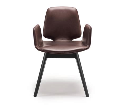 Malena armchair has aluminium legs with castors at the front. TILDA | ARMCHAIR WITH WOODEN FRAME 4-LEGS - Chairs from ...