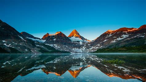 Reflection Of Mount Assiniboine In Magog Lake At Sunrise Alberta