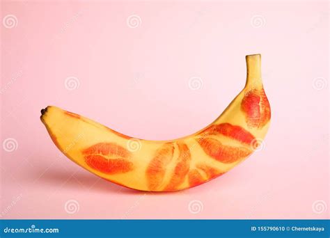 Fresh Banana With Red Lipstick Marks On Pink Oral Sex Concept Stock