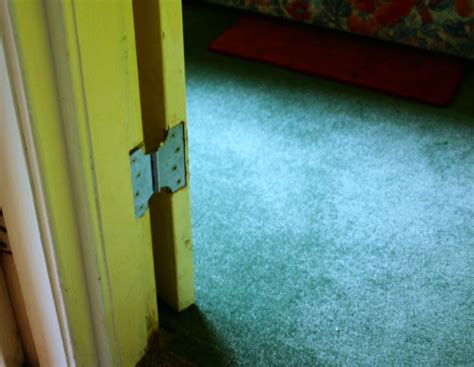 The door should now close without any issue. Parliament hinges allow back bedroom door to open fully