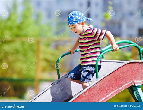 Boy Playing On Slide Stock Photo Image Of Urban Enjoyment 24668592