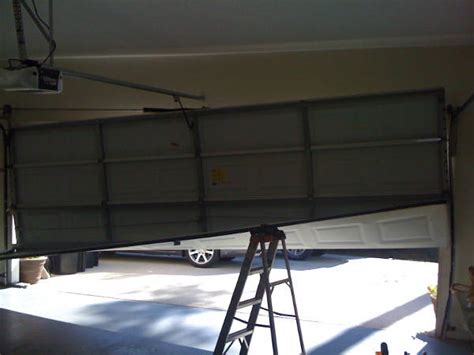 Pull the rope in order to release the door from the opener. Garage Door Track Repair Atlanta Georgia | 5 STAR Service