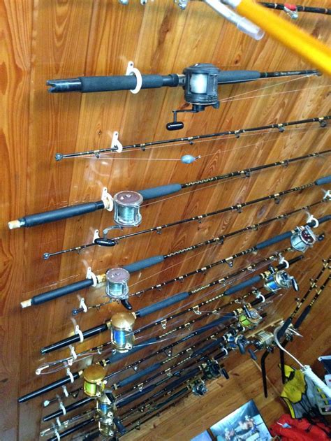 It will hold mops, brooms, and shovels too. Ceiling Fishing Rod Rack - WoodWorking Projects & Plans