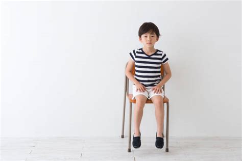 Kid Sitting On Chair Stock Photos Pictures And Royalty Free Images Istock