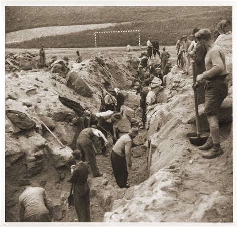 There are no featured reviews for because the movie has not released yet (). Austrian civilians dig a mass grave in the former SS ...