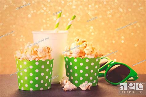 Popcorn Drink And Glasses For Movie Toned On Gold Background Stock