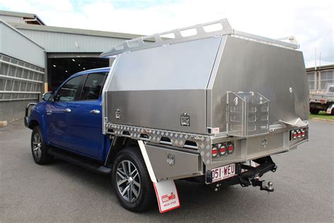 Another fitment of an amarok canopy, this time with a unique colour scheme. Toyota Hilux Aluminium Canopy | Motorcycle camping, Truck ...