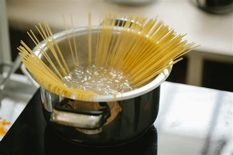 Spaghetti Cooking In Boiling Water In Saucepan · Free Stock Photo