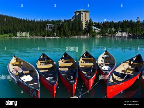 Canoes At Dock Near Fairmont Chateau Lake Louise Hotel In Banff