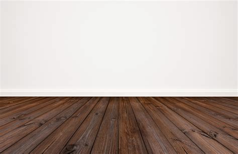 Dark Wood Floor With White Wall Background Stock Photo