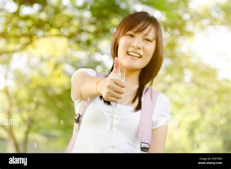 Young Asian College Girl Student Thumb Up Stock Photo Alamy