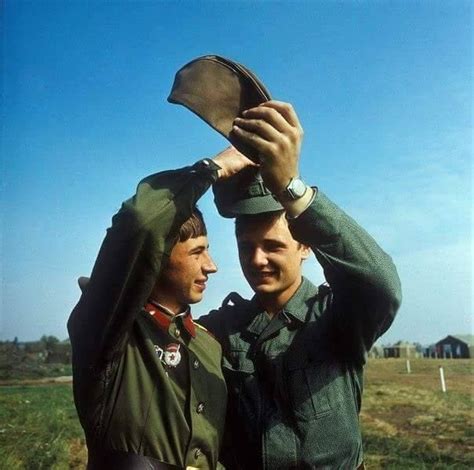 in a gesture of friendship during the warsaw pact drills a soviet army soldier exhanges his