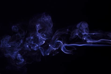 Free Photo Movement Of Purple Smoke Abstract On Black Background